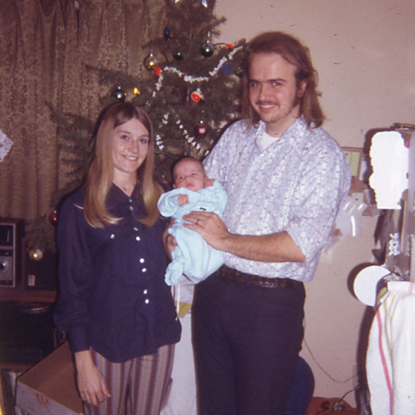 Bill Gilles with his wife and newborn at Christmas